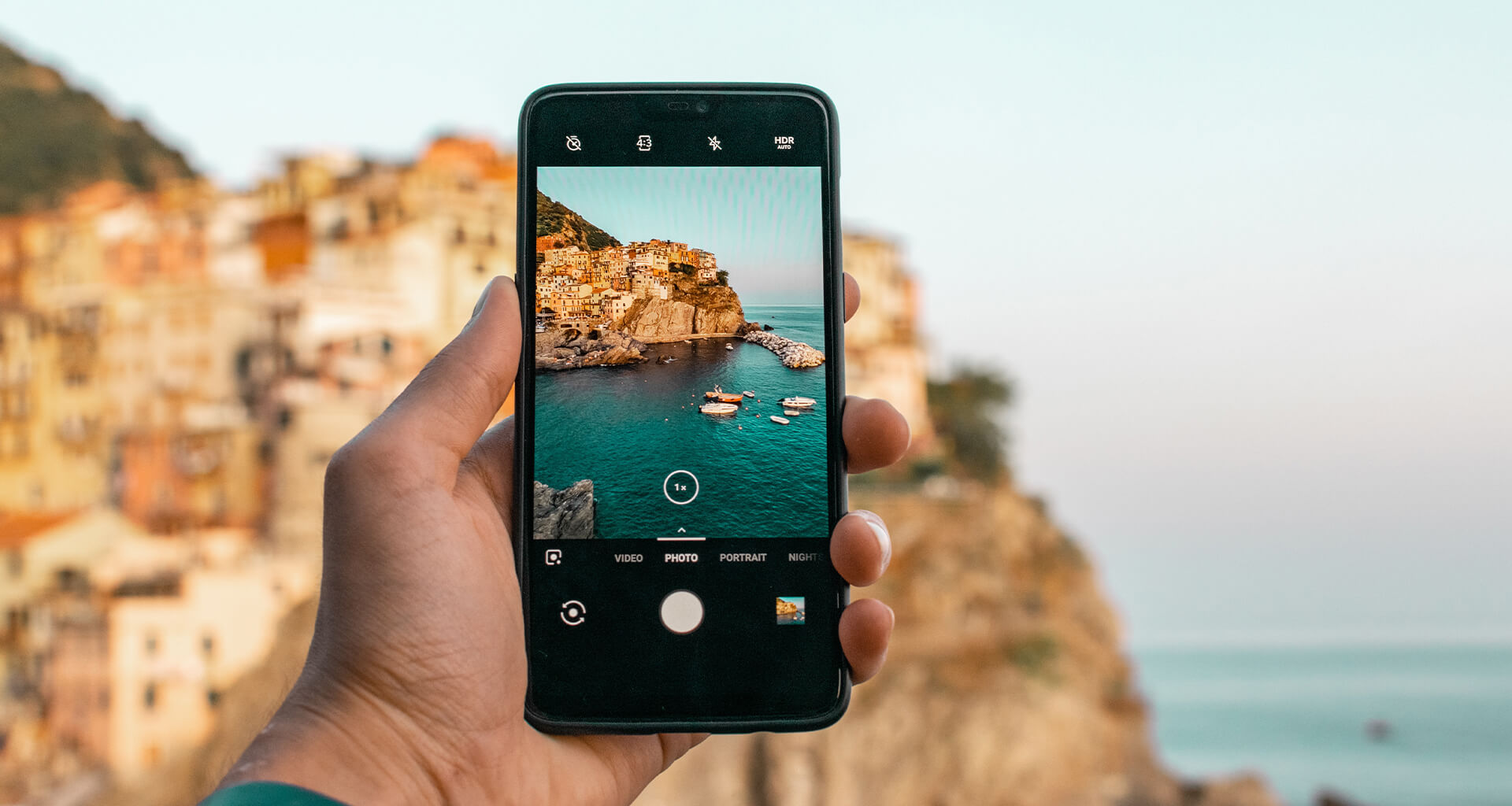 Phone taking a photo of a landscape