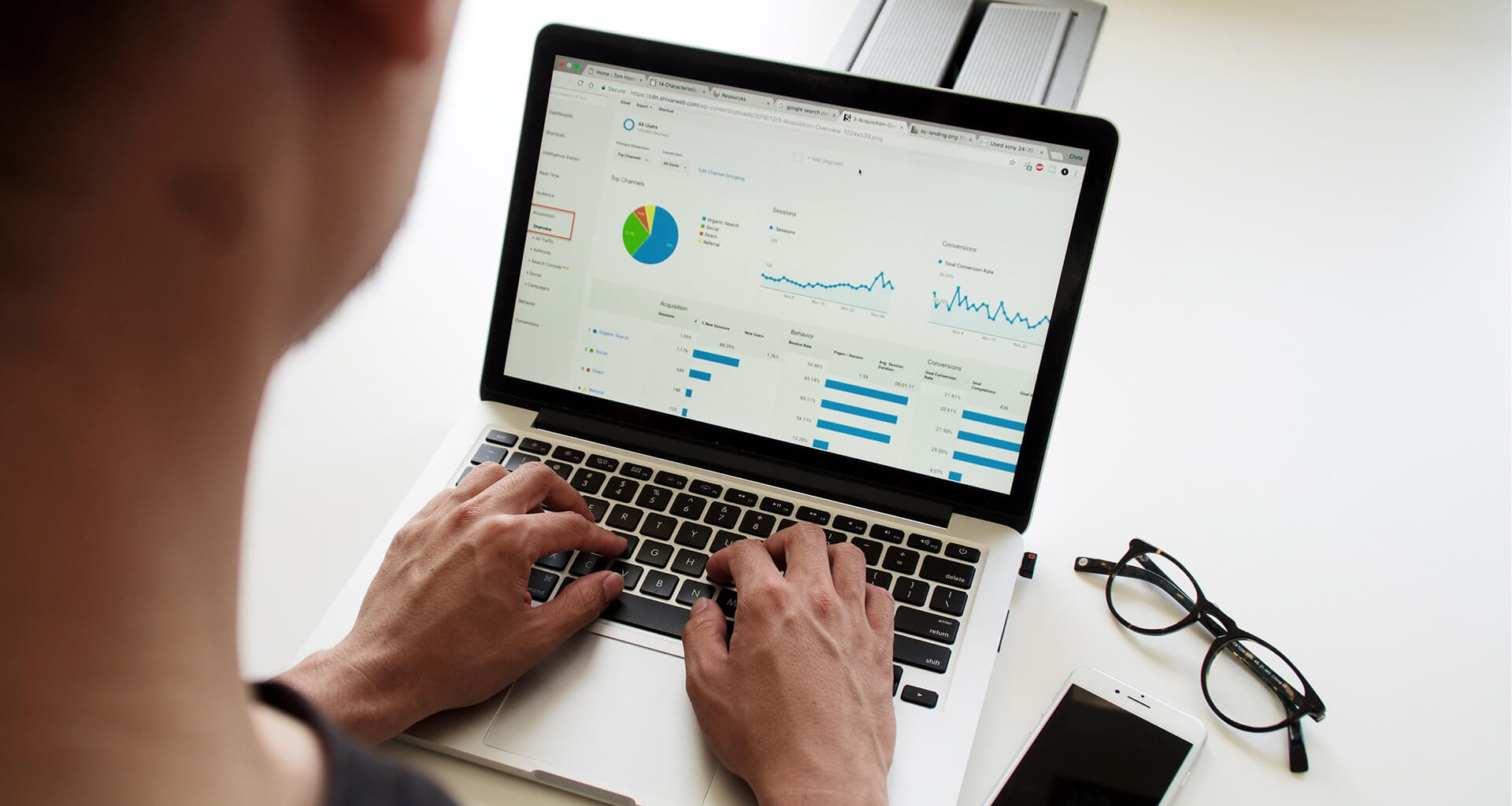 Person looking at analytical data on a laptop